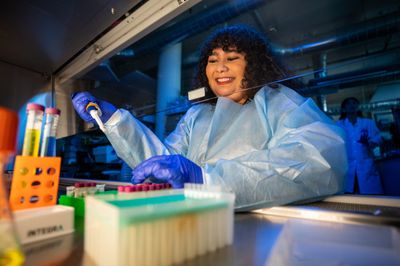 NAU student works with vials in a research lab.