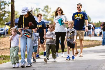 An prospective student's family attends the Discover NAU even while dressed in NAU gear.