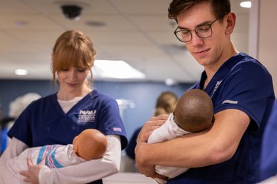 Students attending class and working as part of the School of Nursing.