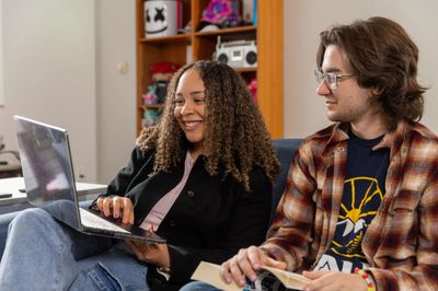 NAU students laugh during a study session in their campus residence.