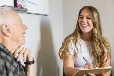 An NAU Psychology student works with a patient at the Healthy Aging Lab.